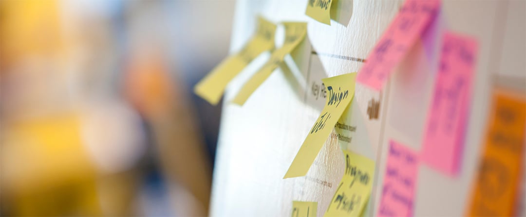 Marketing and business leaders collaborating during a design thinking workshop